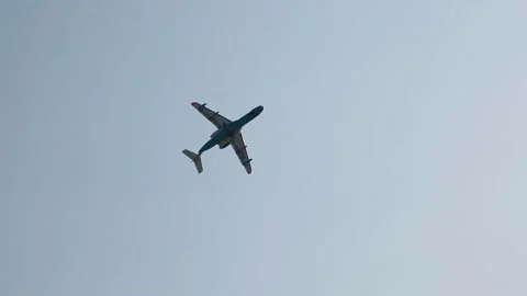 A large cargo plane performs aerobatics at an air show Stock Footage 242791698