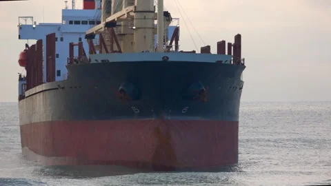 A large cargo sea ship sails on the ocean among the waves Video stock 257101941