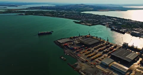 Large Cargo Ship Approaching Dock For Unloading High Altitude Aerial Still Shot Stock Footage 300506828