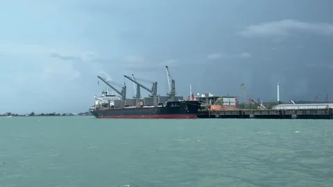 A large cargo ship docked at the industrial port terminal in Sihanoukville 스톡 동영상 337082333