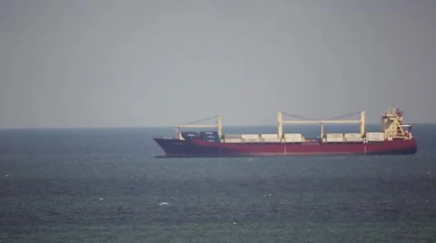 Large Cargo Ship Drifting at sea Stock Footage 64128414
