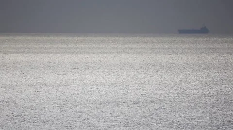 Large Cargo Ship Drifting at sea Stock Footage 64128417