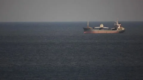 Large Cargo Ship Drifting at sea Stock Footage 64128452