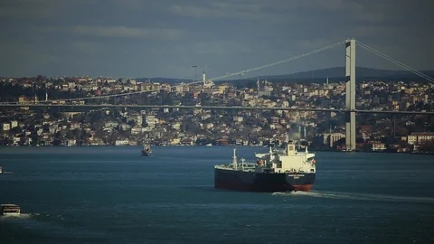Large cargo ship floats under the transport bridge. Transportation, industrial Video stock 105274927