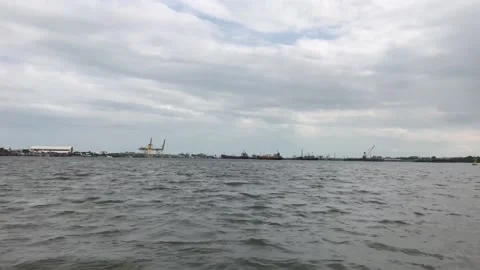 A large cargo ship is on its way to deliver goods through the Chao Phraya River Stock Footage