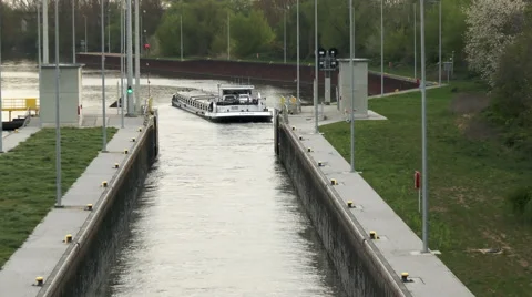 Large cargo ship is leaving a sluice Stockbeeldmateriaal 49214335