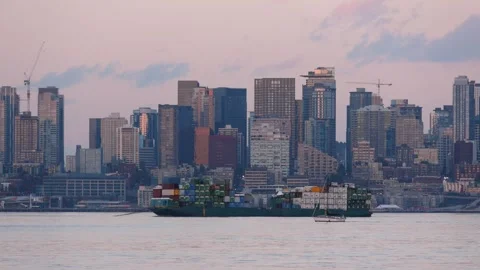Large cargo ship loaded with containers sailing on elliott bay with the Sea.. Video stock 329660406