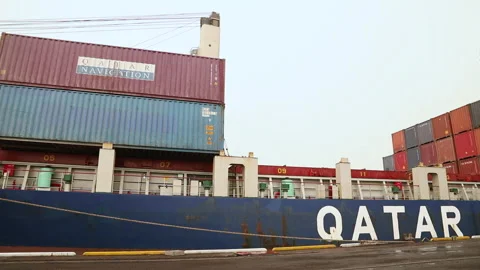 Large cargo ship loading containers at the port in Qatar Stock Footage 318188672
