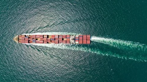 Large Cargo Ship Navigating Across Open Blue Sea Near Si Racha Chon Buri Th.. 库存照片