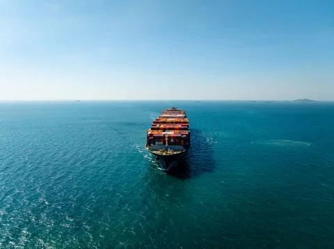 Large Cargo Ship Navigating Across Open Ocean Near Laem Chabang Thailand Wi.. Stock Photos