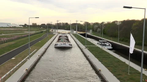 Large cargo ship is navigating in a sluice Stockbeeldmateriaal 49214633