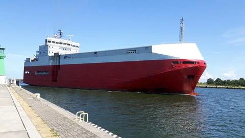 Large Cargo Ship Passing Through Sea Channel Stock Photos