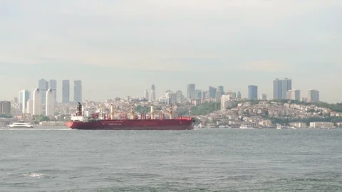 A large cargo ship sail along the Bosphorus strait with Istanbul in background Stock Footage 97170747