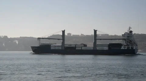 Large cargo ship sailing on Tagus River. Video stock 48977252