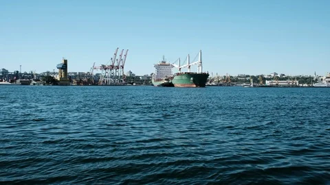 Large cargo ship sails near, the ship is green. Odessa Ukraine Stock Footage 102485481