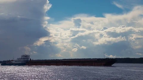 A large cargo ship sails on the river Stock Footage 80133397
