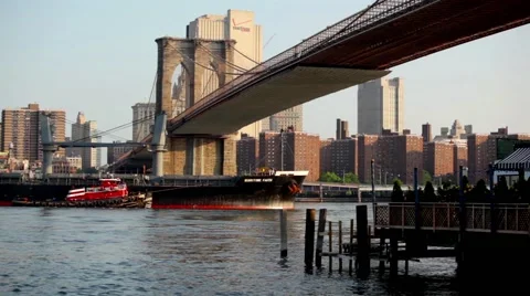 Large Cargo Ship Sails Under Brooklyn Bridge Delivering Goods To NYC Stock Footage 52180330