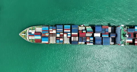 Large Cargo Ship Transporting Colorful Containers Across The Ocean Wide Shot Video stock 331007569