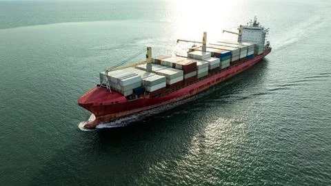 Large Cargo Ship Transporting Shipping Containers Across The Sea Near Chon .. Photos
