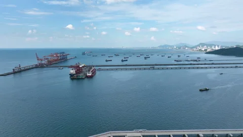 Large cargo ships parked at a large export warehouse in an industrial area. Stock Footage 292352047