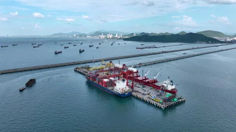 Large cargo ships parked at a large export warehouse in an industrial area. Stock Footage 292352080