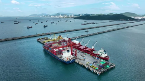 Large cargo ships parked at a large export warehouse in an industrial area. Stock Footage 292598637