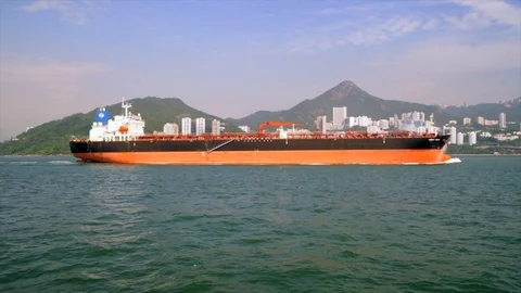 Large cargo tanker sailing though scenic Hong Kong bay Stock Footage 99380131