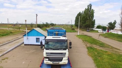 Large cargo trucks weighing cargo on truck scales in rural area Video stock 148324698