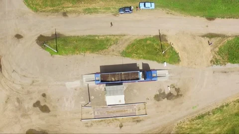 Large cargo trucks weighing cargo on truck scales in rural area Stock Footage 148324708