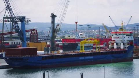 Large Cargo Vessel in Port Ready to Load Containers for Worldwide Distribution Stock Footage 345937908