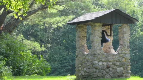 Large Cast Iron Bell Inside Stone Well Video stock 58104342