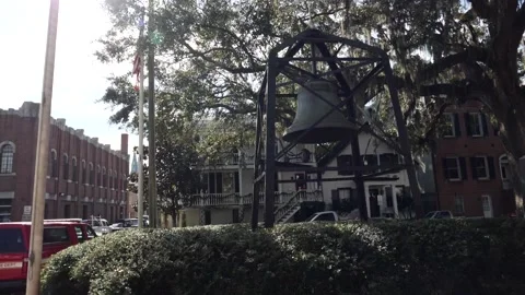 Large cast iron bell mounted in a frame in a city square Stock Footage 153662135