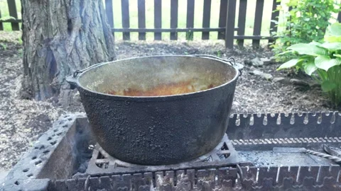 Large Cast Iron Cauldron on a Grill, 8K Resolution Stock Footage 336747218