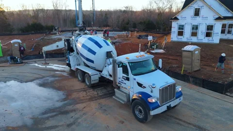 Large Cement Mixer Working On A New Residential Development Project. Aerial Stock Footage 337688746