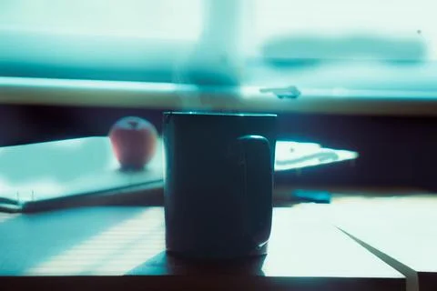 A large ceramic cup with hot tea. The tea cooling in the cup on the table. Stock Photos