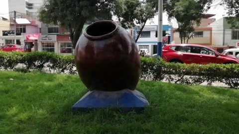 Large ceramic jug on the green grass Stock Footage 123812429