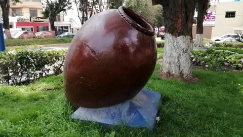 Large ceramic jug on the green grass Stock Footage 123812572