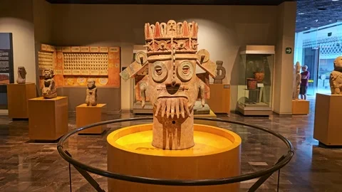 Large Ceramic Rain Deity Figure on Lit Platform, Mexico 8K Video stock 340371211