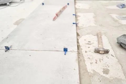 Large Ceramic tiles in the loft style, concrete. Repair of the dining room in Stock Photos