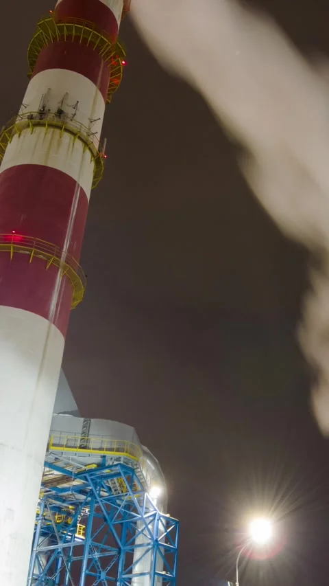 Large chimneys smoke in a large enterprise, tilt vertical time-lapse Stock Footage 288015119