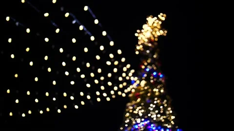 Large Christmas tree covers with bight and flashing lights Stock Footage 166662669
