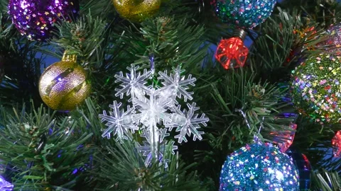 A large Christmas tree decorated with balls and snowflakes Stock Footage 166703089