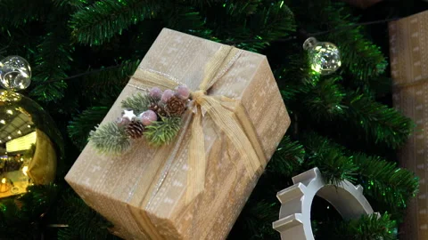 Large Christmas tree decorated with large balls, gears and sealed gifts close-up Stock Footage 145001112