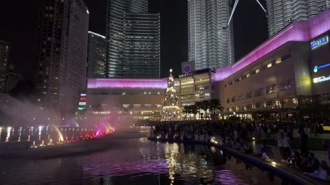 Large Christmas tree is lit up in the KLCC Video stock 315685237