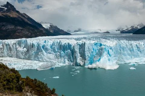 Large chunk of ice is breaking off the Perito Moreno Glacier Stock Photos