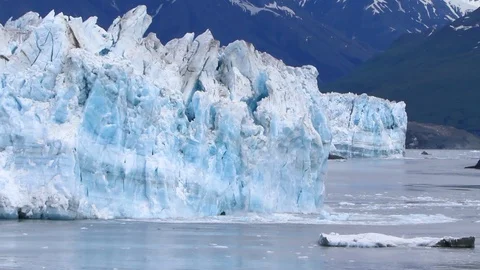 Large chunk of ice calving off Hubbard Glacier Stock Footage 128219974