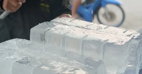 A large chunk of ice was cut with an axe.Close up hand cut ice. Stock Footage 241932079