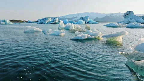 Large Chunks of Ice Float in Turquoise Glacier Lagoon in Iceland Clear Blue 스톡 동영상 247941592