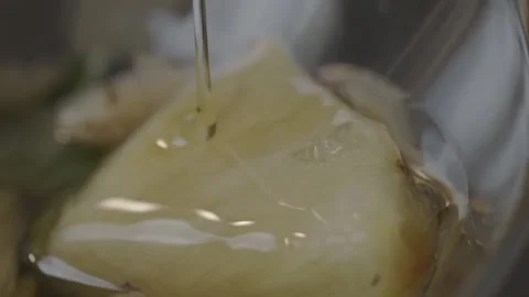 Large chunks of pineapple covered with organic honey from the Amazon 스톡 동영상 169137231