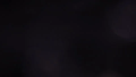 Large circular blue bokeh light flashing in the dark Video stock 309233025